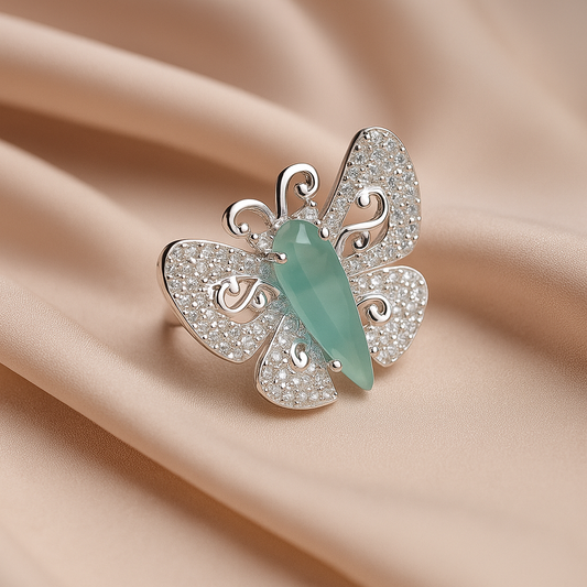 Elegance Unfolds: Black Butterfly Ring Light Blue