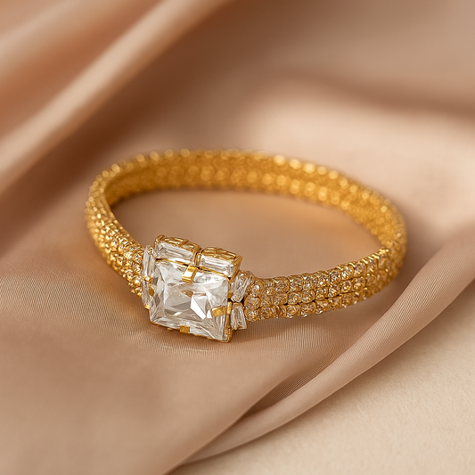 Elegance Embraced: Emerald Cut Gold Bangle