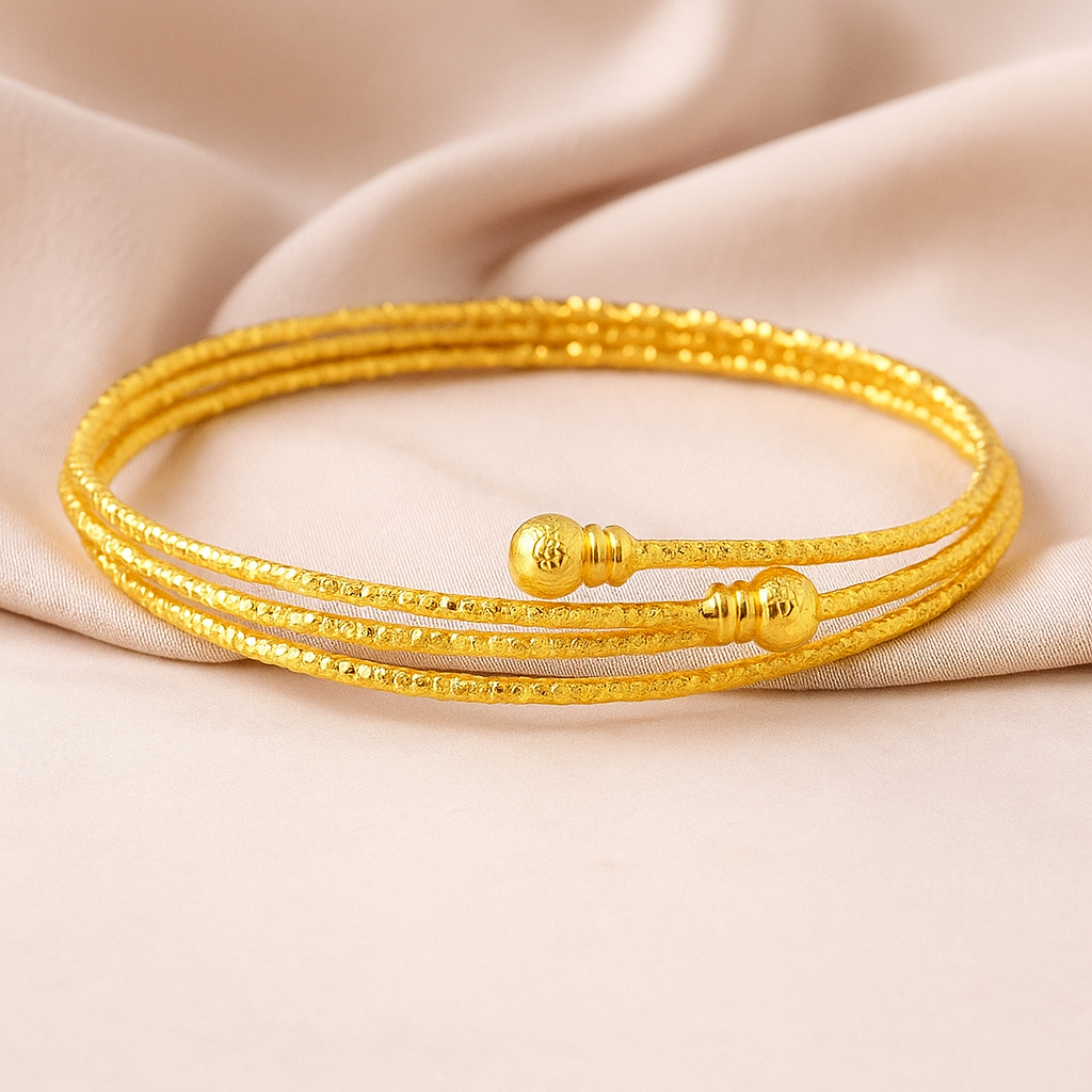 Elegant Triple Strand Gold Bangle with Textured Detailing